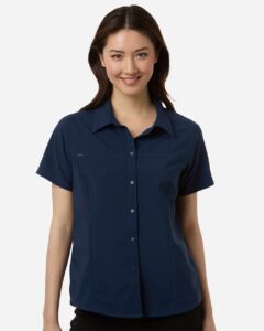CORE365 CE520W Women’s UltraUVP Shoreline Short Sleeve Staff Shirt – Classic Navy (on model)