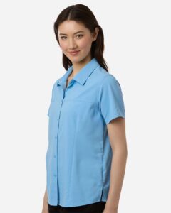 CORE365 CE520W Women’s UltraUVP Shoreline Short Sleeve Staff Shirt – Columbia Blue (on model side)