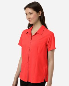CORE365 CE520W Women’s UltraUVP Shoreline Short Sleeve Staff Shirt – Marina Red (on model side)