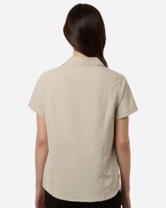 CORE365 CE520W Women’s UltraUVP Shoreline Short Sleeve Staff Shirt – Stone (on model back)