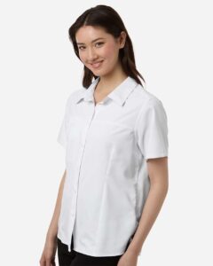 CORE365 CE520W Women’s UltraUVP Shoreline Short Sleeve Staff Shirt – White (on model side)