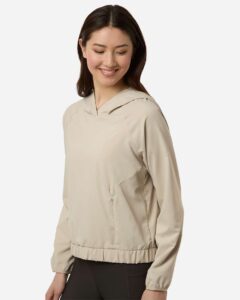 CORE365 CE520LW Women’s UltraUVP Shoreline Long Sleeve Hooded Pullover – Stone (on model side)