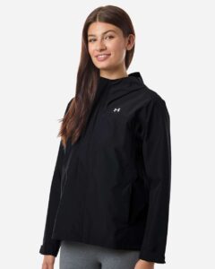 Under Armour 6009571 Women’s Cloudstrike Jacket – Black/ White (on model side)