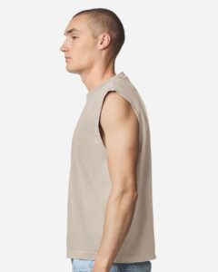 American Apparel 207GD Unisex Heavyweight Cotton Garment-Dyed Boxy Muscle Tee – Faded Bone (on model side)