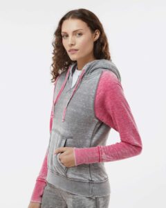 J. America 8926 Women’s Zen Fleece Raglan Hooded Sweatshirt – Cement/ Wildberry (on model side)