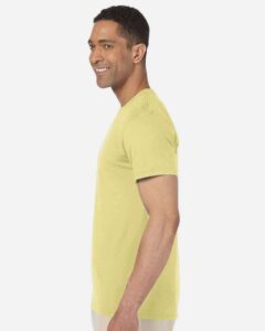 Gildan 64000 Unisex Softstyle® T-Shirt – Cornsilk (on model side)