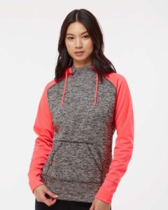 J. America 8618 Women’s Colorblocked Cosmic Fleece Hooded Sweatshirt – Charcoal Fleck/ Fire Coral (on model)