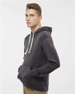 J. America 8871 Men’s Triblend Fleece Hooded Sweatshirt – Black Triblend (on model side)
