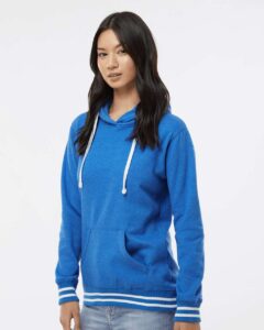 J. America 8651 Women’s Relay Hooded Sweatshirt – Royal (on model side)