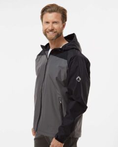 DRI DUCK 5335 Unisex Torrent Waterproof Hooded Jacket – Charcoal/ Black (on model side)