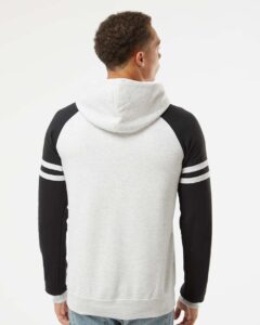 JERZEES 97CR Unisex Nublend® Varsity Colorblocked Raglan Hooded Sweatshirt – Oatmeal Heather/ Black Ink (on model back)
