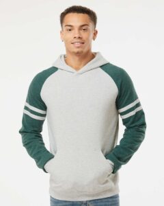 JERZEES 97CR Unisex Nublend® Varsity Colorblocked Raglan Hooded Sweatshirt – Oatmeal Heather/ Forest Green Heather (on model)