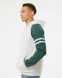 JERZEES 97CR Unisex Nublend® Varsity Colorblocked Raglan Hooded Sweatshirt – Oatmeal Heather/ Forest Green Heather (on model side)
