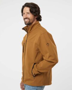 DRI DUCK 5350 Men’s Motion Soft Shell Jacket – Saddle (on model side)