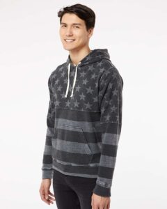 J. America 8871 Men’s Triblend Fleece Hooded Sweatshirt – Black Stars & Stripes Triblend (on model side)