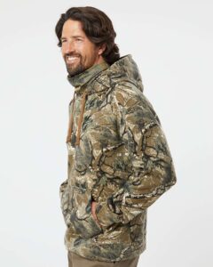 J. America 8879 Men’s Gaiter Fleece Hooded Sweatshirt – Outdoor Camo (on model side)
